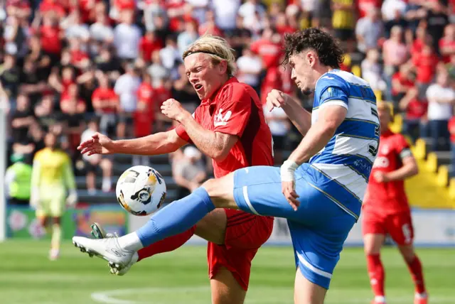 Aberdeen's Alexander Jensen and Greenock Morton's Zak Delaney in action during a Premier Sports Cup Second Round match between Greenock Morton and Aberdeen at Cappielow Park