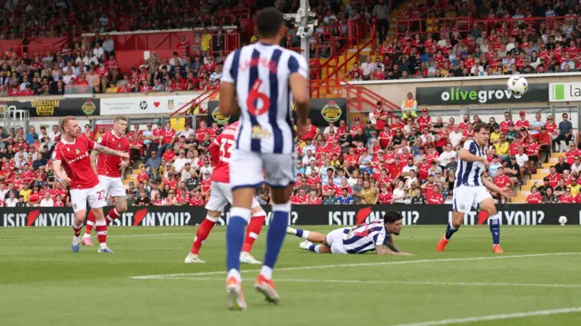 Lewis O'Brien of Wrexham scores a goal
