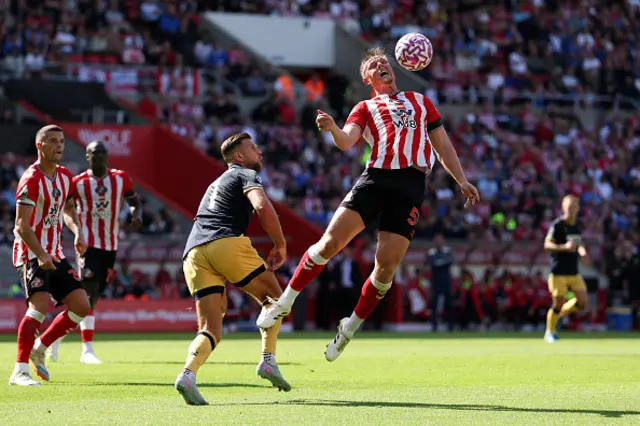 Daniel Ballard of Sunderland controls the ball in the air under pressure from Niclas Fullkrug