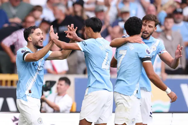 Rayan Cherki of Manchester City celebrates scoring the fourth goal with team mates