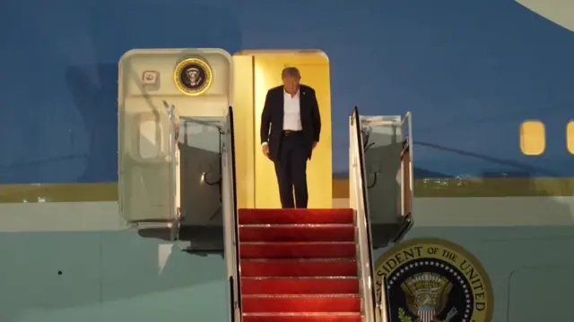 Trump leaving Air Force One by the front stairs.