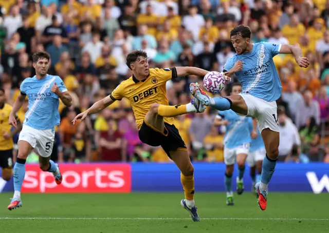 Jorgen Strand Larsen of Wolverhampton Wanderers battles for possession with Nico Gonzalez
