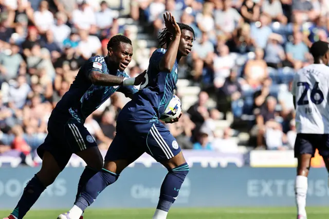 Jeremy Monga of Leicester City celebrates with Abdul Fatawu
