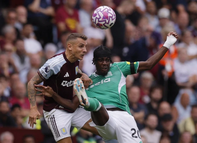 Aston Villa's Lucas Digne in action with Newcastle United's Anthony Elanga