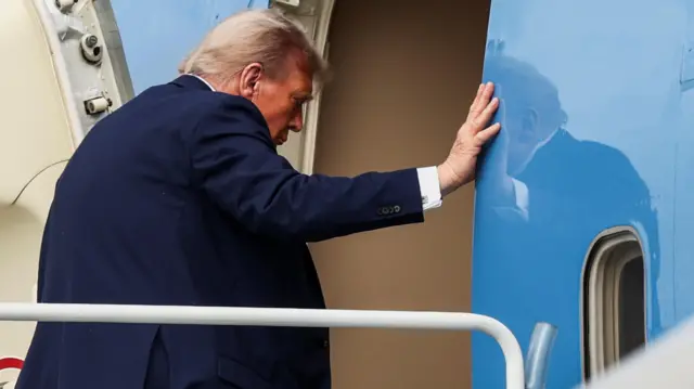 US President Donald Trump boards Air Force One as he departs