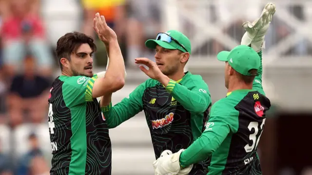 Jordan Thompson of Southern Brave celebrates with team mates after taking the wicket of Joe Root of Trent Rockets