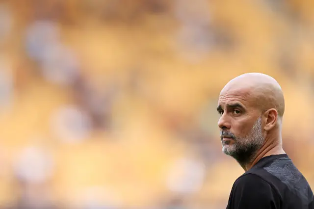 Manchester City manager Pep Guardiola looks on