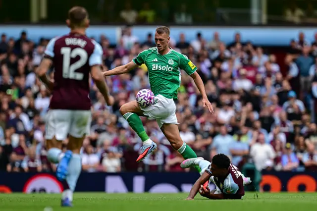 Dan Burn of Newcastle United (33) controls the ball