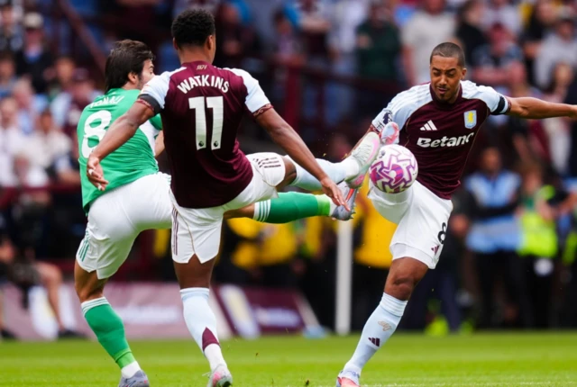Aston Villa's Ollie Watkins and Youri Tielemans combine to tackle Newcastle United's Sandro Tonali