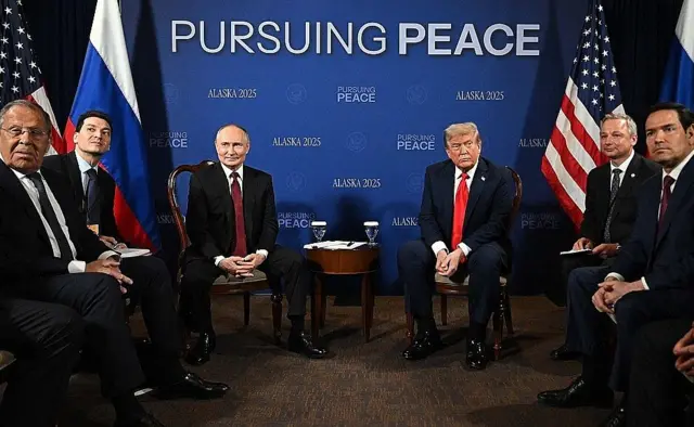 Left to right: Russian Foreign Minister Sergey Lavrov and Presidential Aide for International Affairs Yury Ushakov, Vladimir Putin, Donald Trump, US Secretary of State Marco Rubio and Special Envoy Steve Witkoff sit in a semi-circle