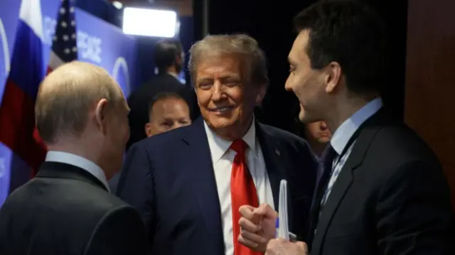 Trump and Putin speak, with Trump smiling