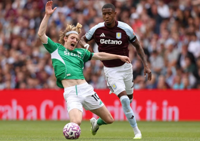 Aston Villa's Ezri Konsa fouls Newcastle United's Anthony Gordon and is later sent off