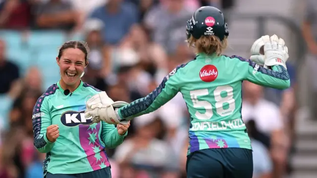 Alice Capsey of Oval Invincibles celebrates with teammate Lauren Winfield-Hill