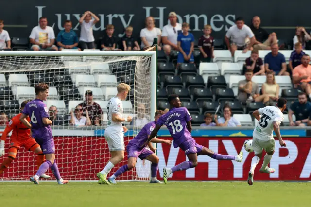 Swansea City's Ronald (right) scores