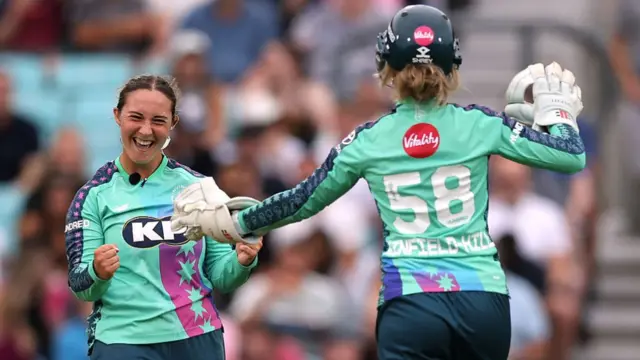 Alice Capsey of Oval Invincibles celebrates with teammate Lauren Winfield-Hill