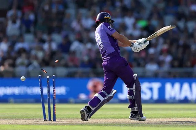 Dawid Malan of Northern Superchargers is bowled by Sonny Baker of Manchester Originals