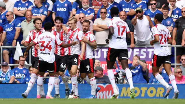 Jay Robinson of Southampton (centre) celebrates with team-mates after scoring their side's first goal of the game
