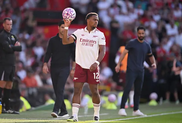 Jurrien Timber of Arsenal takes his sides throw in
