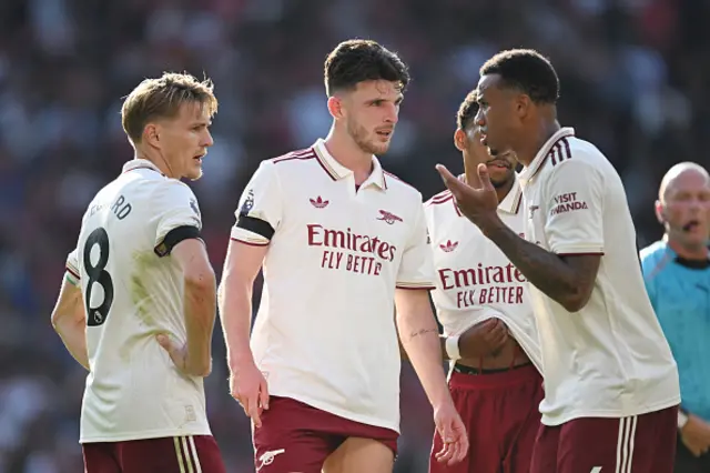 Martin Odegaard, Declan Rice and Gabriel of Arsenal interact