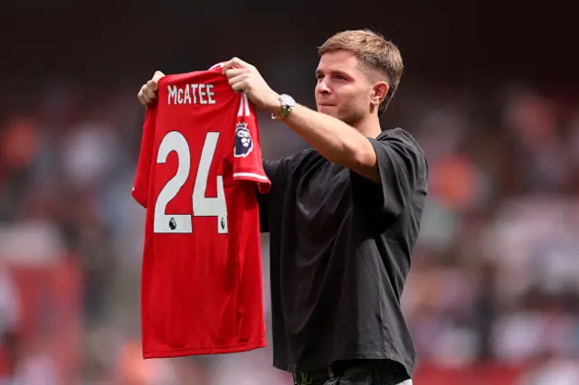 James McAtee of Nottingham Forest holds up his shirt