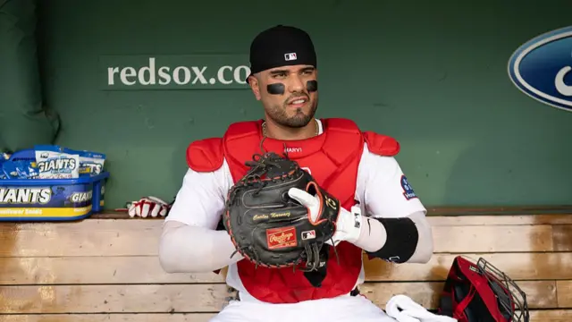 Carlos Narváez #75 of the Boston Red Sox looks on in the dugout
