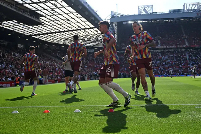 Martin Zubimendi (C) warms up