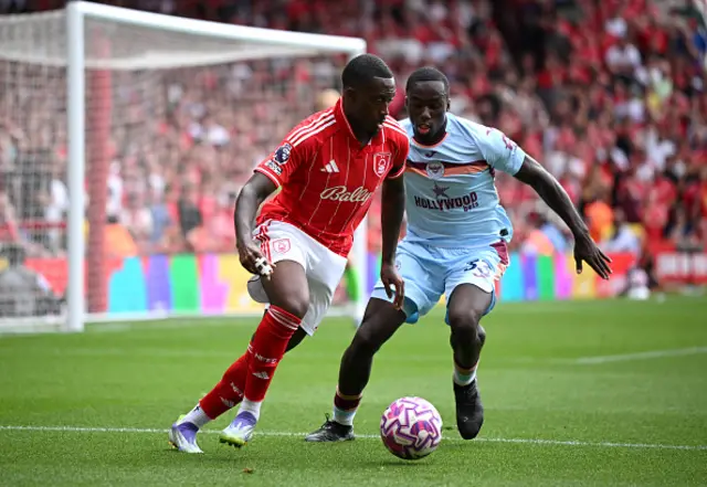 Callum Hudson-Odoi of Nottingham Forest battle for possession against Michael Kayode