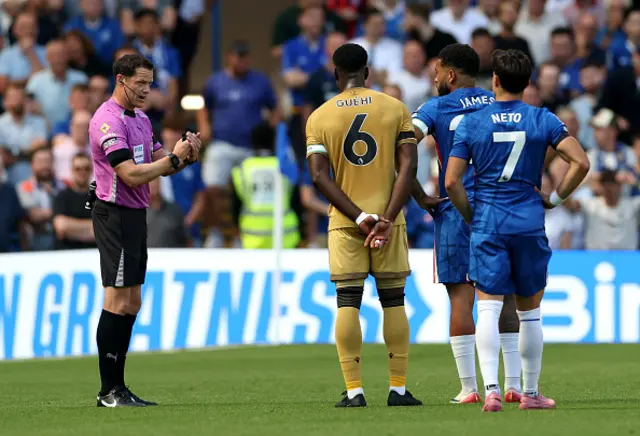Match Referee Darren England competes a VAR check after Eberechi Eze