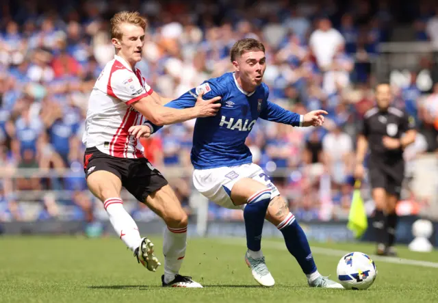 Ipswich Town's Sammie Szmodics and Southampton's Flynn Downes battle for the ball