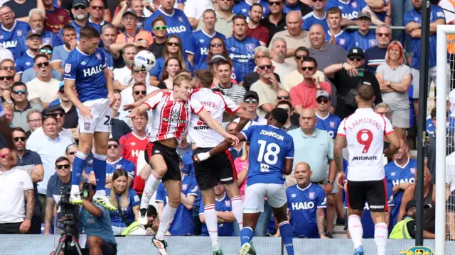 Dara O'Shea of Ipswich Town (left) attempts a header on goal