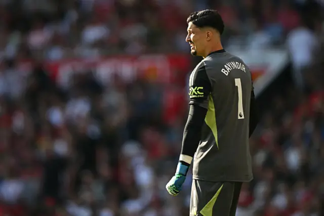 Altay Bayindir looks on