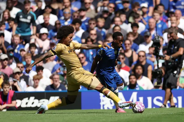 Jamie Gittens of Chelsea is challenged by Chris Richards