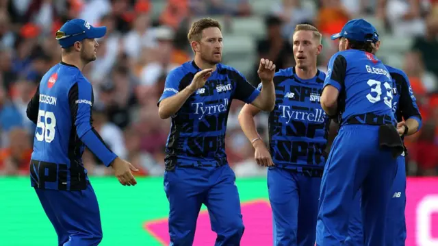 Liam Dawson of London Spirit celebrates with team mates after taking the wicket of Ben Duckett