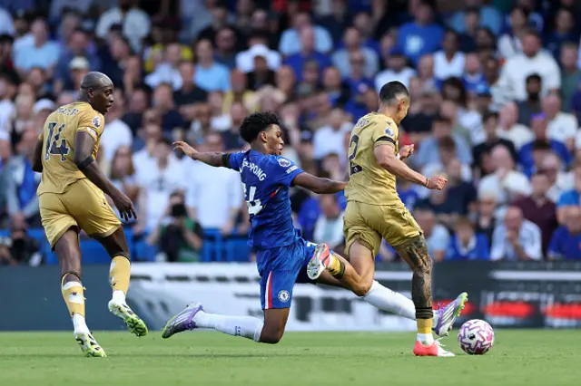 Josh Acheampong of Chelsea is challenged by Daniel Munoz
