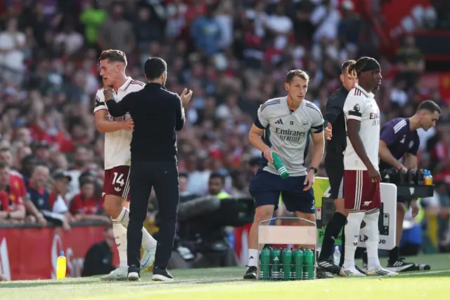 Viktor Gyoekeres of Arsenal interacts with Mikel Arteta