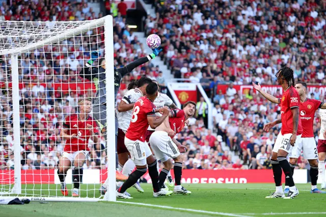 Altay Bayindir of Manchester United fails to save a header
