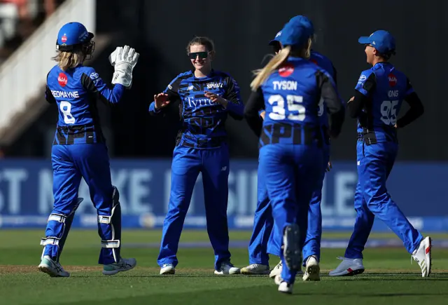 Charlie Dean of London Spirit celebrates with her team mates