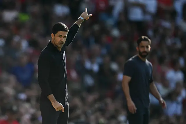 Arsenal's Spanish manager Mikel Arteta (L) and Manchester United's Portuguese head coach Ruben Amorim (R) watch from the touchline