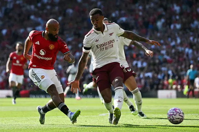 Bryan Mbeumo (L) has a shot