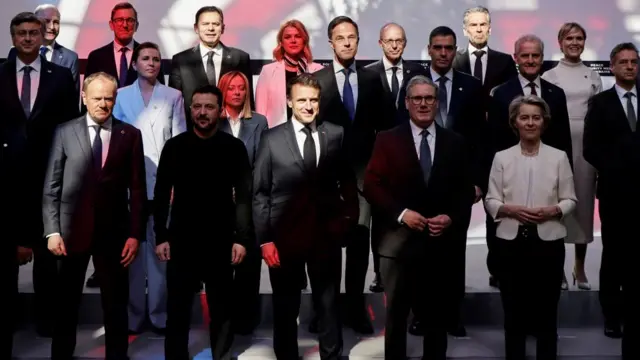 Poland's Prime Minister Donald Tusk, Ukraine's President Volodymyr Zelensky, France's President Emmanuel Macron, Britain's Prime Minister Keir Starmer and European Commission President Ursula Von der Leyen pose for a family picture during a meeting as part of a summit for "Coalition of the Willing".