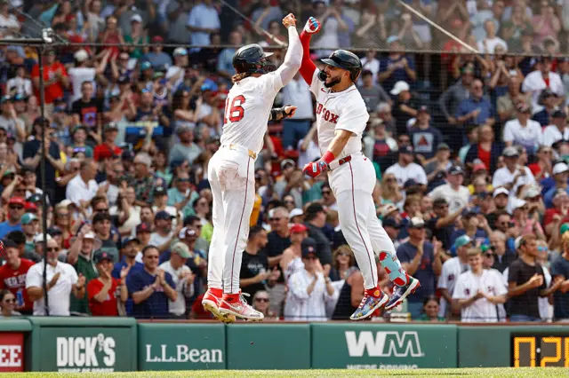 Wilyer Abreu #52 of the Boston Red Sox is congratulated by Jarren Duran #16