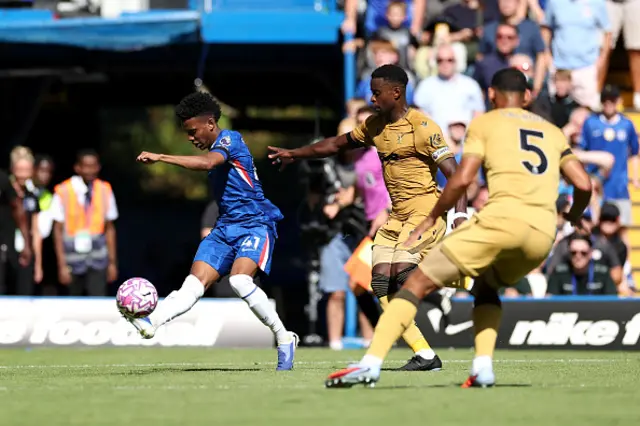 Estevao of Chelsea is challenged by Marc Guehi