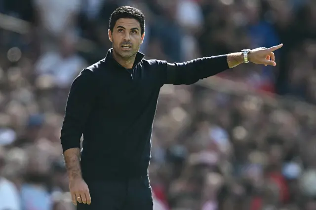 Mikel Arteta gestures