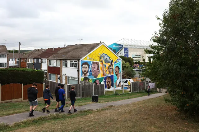 Fans walk to the stadium