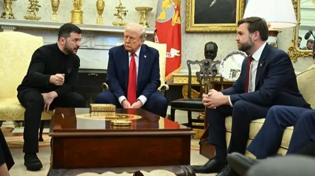 Ukraine's President Volodymyr Zelensky speaks to US Vice President JD Vance as they meet with President Donald Trump in the Oval Office of the White House