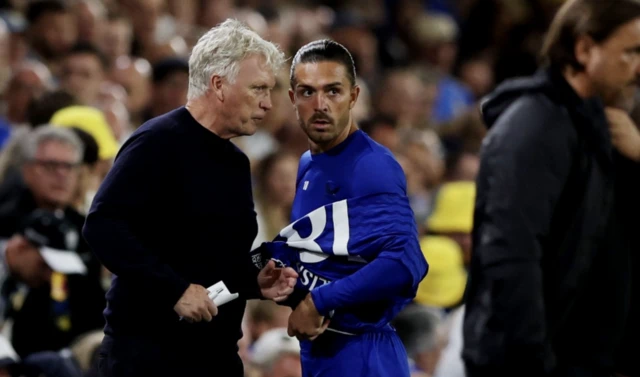 Everton's Jack Grealish with manager David Moyes as he gets ready