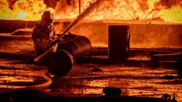 A firefighter works at the site of a Russian drone strike in Odesa
