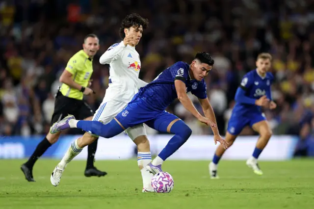 Ao Tanaka of Leeds United clashes with Charly Alcaraz