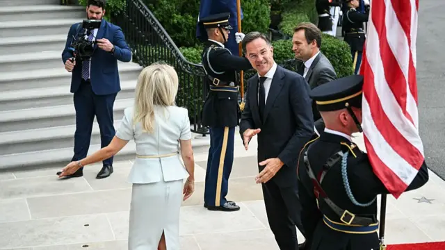 NATO Secretary-General Mark Rutte is greeted by US Chief of Protocol Monica Crowley (L) upon arrival at the White House