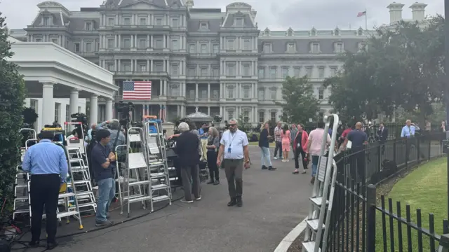 Photographers outside the White House